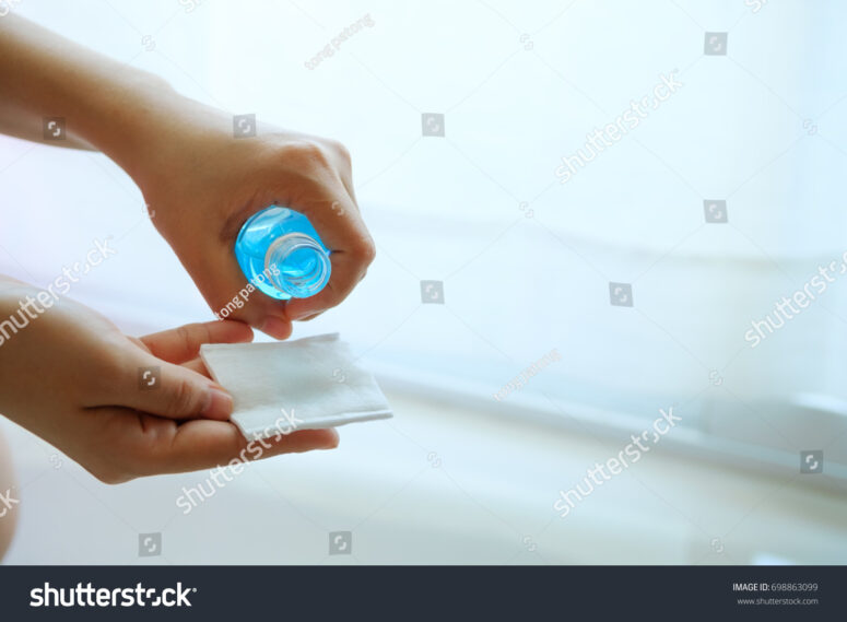  stock-photo-hand-holding-ethyl-alcohol-bottle-and-cotton-piece-backgroud